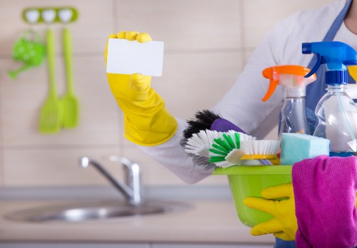 Carpet cleaners working safely with equipment in a Hammersmith home